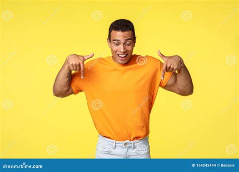 Excited Good Looking Handsome Hispanic Masculine Guy Wear Orange T