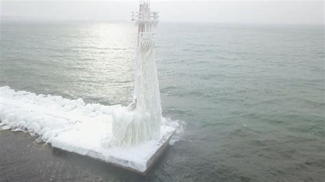 Drone Captures Frozen Lighthouses On Lake Michigan Youtube