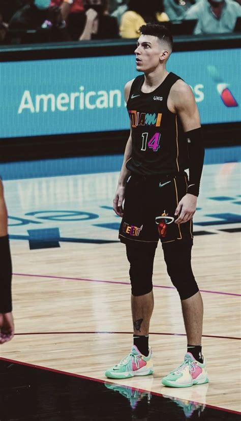 a man standing on top of a basketball court