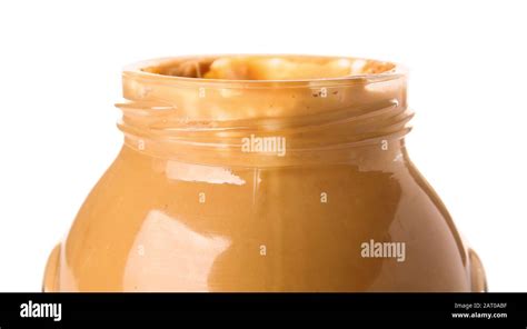 Tasty peanut butter in jar on white background Stock Photo - Alamy