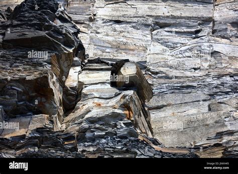 Geological Cliff Structures With Limestone And Soft Crumbling Oil