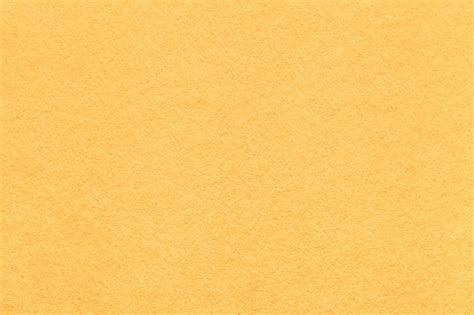 Premium Photo | Light yellow paper texture background