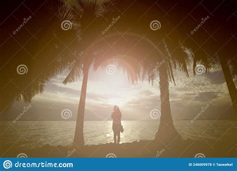 Silhouette Of Young Woman Standing Alone By The Sea Fitness On The