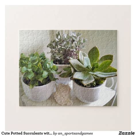 Three Potted Plants Sitting On Top Of A Puzzle