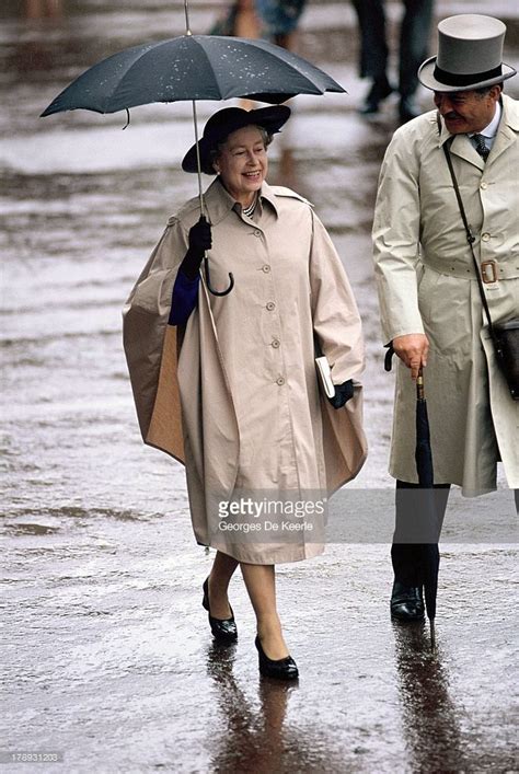 Queen elizabeth ii holds an umbrella during royal ascot on june 21 ...