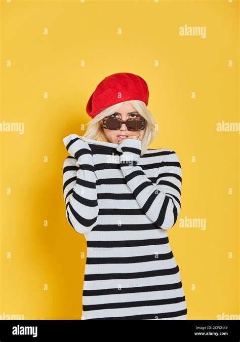 Cheerful Blonde Woman In Sunglasses And Striped Blouse And Red French