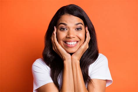 Photo Of Adorable Lady Hands Cheekbones Shiny Smile Wear White Tshirt