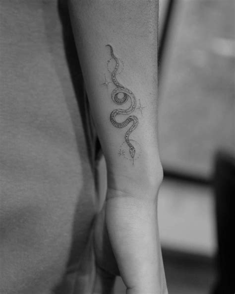 Single Needle Snake Tattoo On The Sydney Parks Wrist