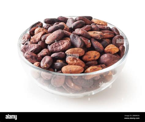 Uncooked Cocoa Beans In Glass Bowl Isolated On White Background With