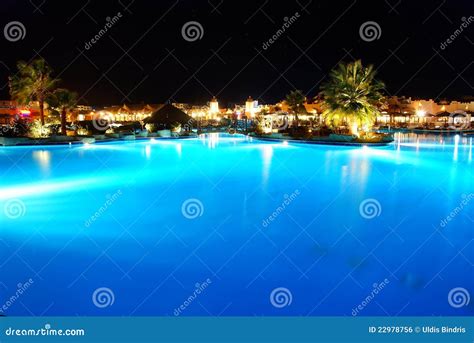 Hotel pool at night stock photo. Image of dusk, blue - 22978756