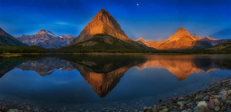 Reflection Of Brown Mountain On Body Of Water Lake Mountains