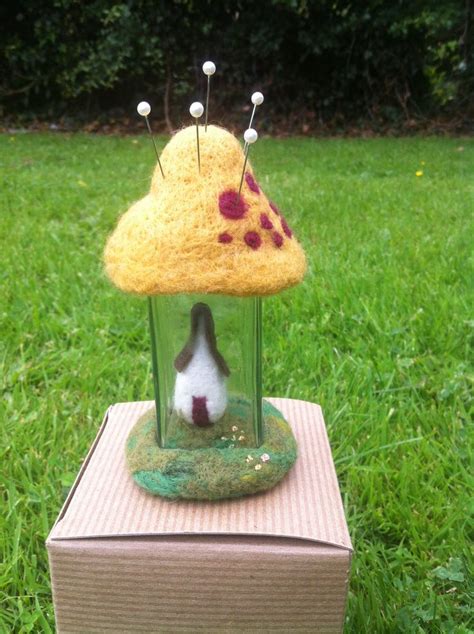 A Needle Felted Pincushion With A Tiny Fairy House Inside Using