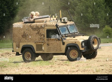 A British Army Land Rover Snatch Vehicle In Desert Camouflage On An