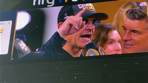 Jim Harbaugh Accepts National Championship Trophy Michigan Wins First