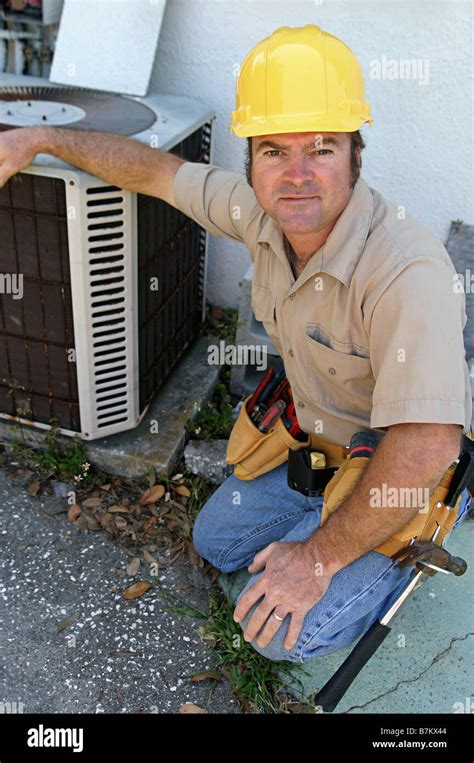 A Handsome Competent Looking Air Conditioning Repairman Stock Photo Alamy