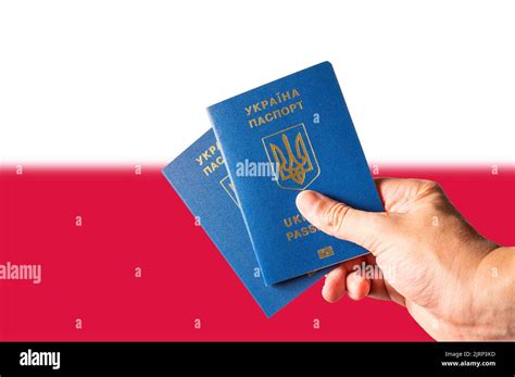 Two Biometric Ukrainian Passports In A Mans Hand Against The