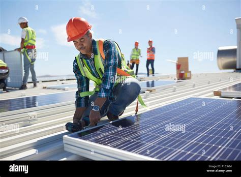 Engineer Installing Solar Panels At Sunny Power Plant Stock Photo Alamy