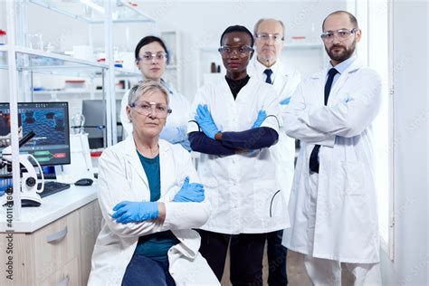 Team Of Professional Scientists Standing Together In Research Lab