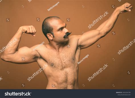 Стоковая фотография 1655334199 Muscular Indian Man Mustache Shirtless Against Shutterstock