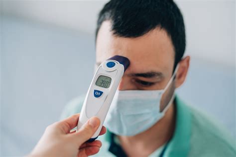 Doctor Measuring Body Temperature With Digital Thermometer Stock Photo ...