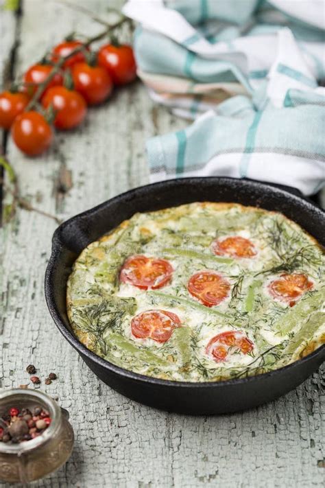 Classic Omelet With Cherry Tomatoes Cheese And Herbs Stock Photo