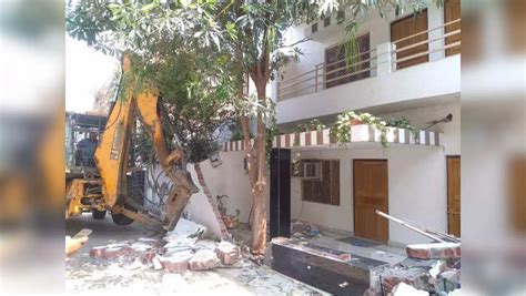 Bulldozer Running At The House Of Atiq Ahmeds Close Friend