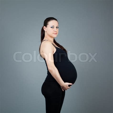 Portrait Of Pregnant Brunette Woman On Stock Image Colourbox