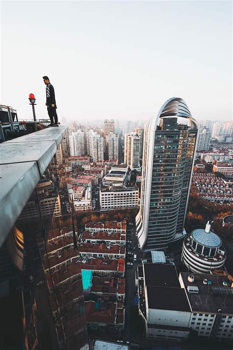 HD wallpaper: Mirror’s Edge, man standing on edge of building's rooftop ...