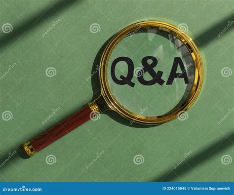 Qna Acronym Through Magnifying Glass On Green And Brown Paper Top View Concept Of Eco