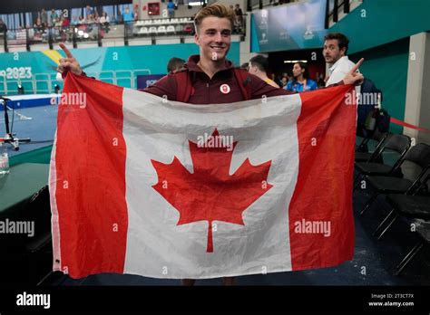 Canadas Felix Dolci Holds His National Flag After Winning Gold In The