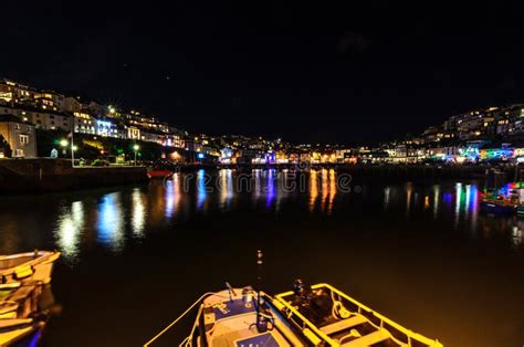 Brixham Harbour at night stock image. Image of water - 199436123