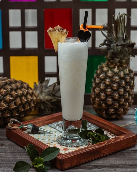 Free Photo | Coconut milk cocktail with pinapple slice on the top