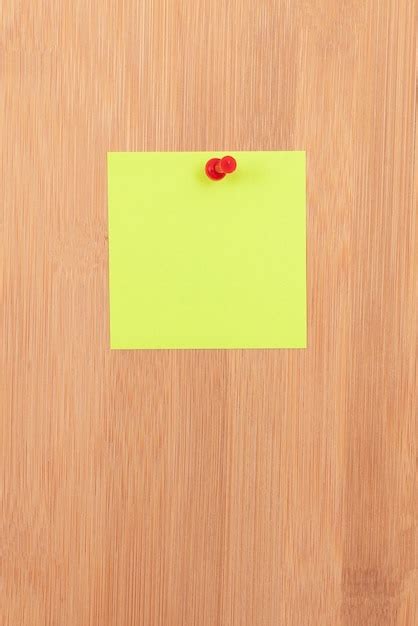 Premium Photo Yellow Sticky Note Pinned To The Wooden Message Board