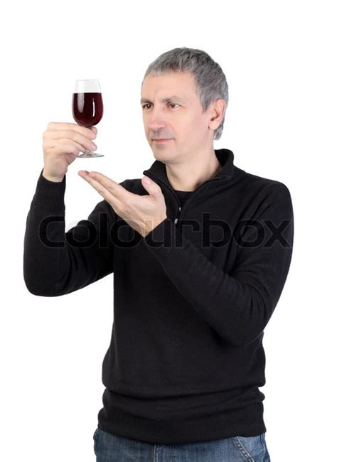 Man Holding A Glass Of Red Port Wine Stock Photo Colourbox