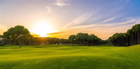 Scenic Panoramic View Of Golf Course At Sunset With Beautiful Sky Golf