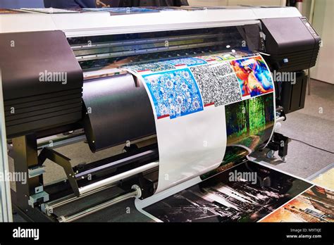 Big rolling wide plotter printer in work Stock Photo - Alamy