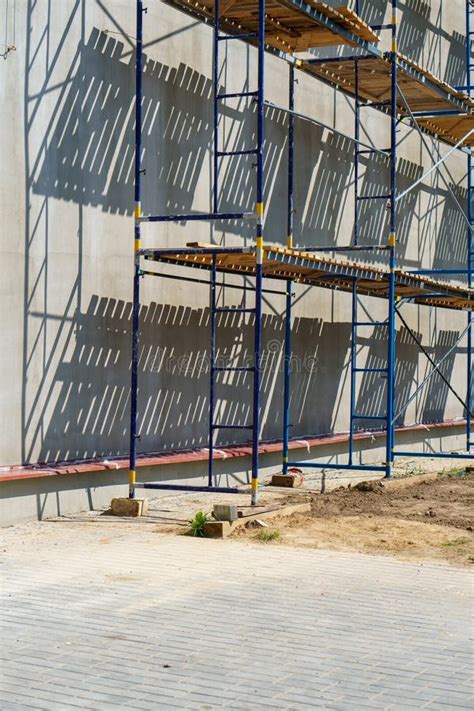 Scaffolding Is Installed Along The Wall Of The Building Under