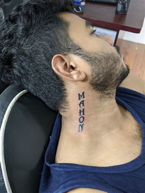 Neck Lettering Tattoo