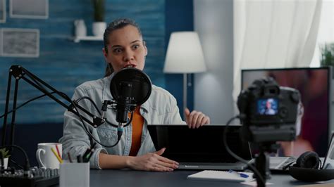 Review show host reviewing high tech laptop while recording . Popular