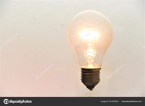 lit light bulb white background