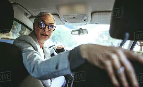 Portrait Of Senior Woman In Driving A Car In Reverse Senior Caucasian Female Driving A Vintage