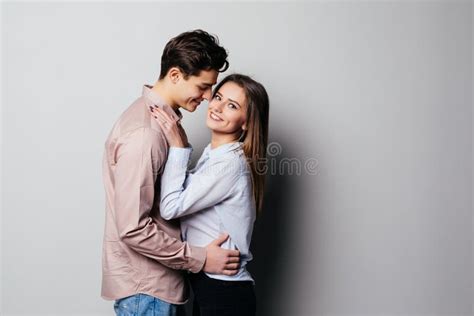 vertical photo   young cheerful people hugging