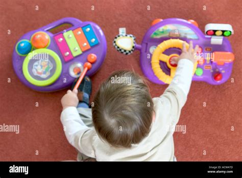 Child playing with toys Stock Photo - Alamy