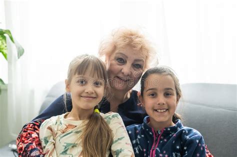 Smiling Loving Mature Grandmother And Two Granddaughters Stock Image Image Of Mature