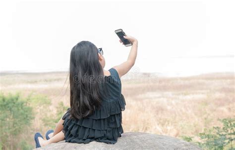 Cute Girl Holding Smartphone To Taking Selfie. Stock Photo - Image of ...