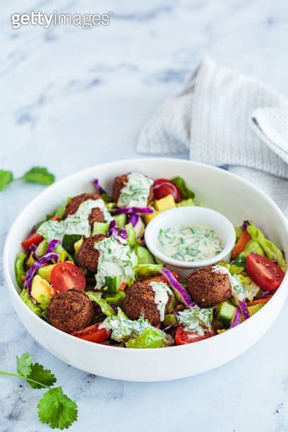 Falafel Salad With Avocado Tomato And Tahini Dressing