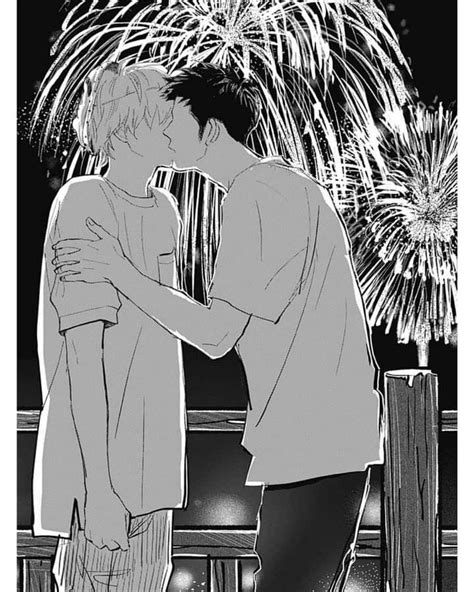 A Man And Woman Kissing In Front Of Fireworks