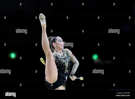 Katsiaryna Halkina From Belarus Performs Her Clubs Routine During