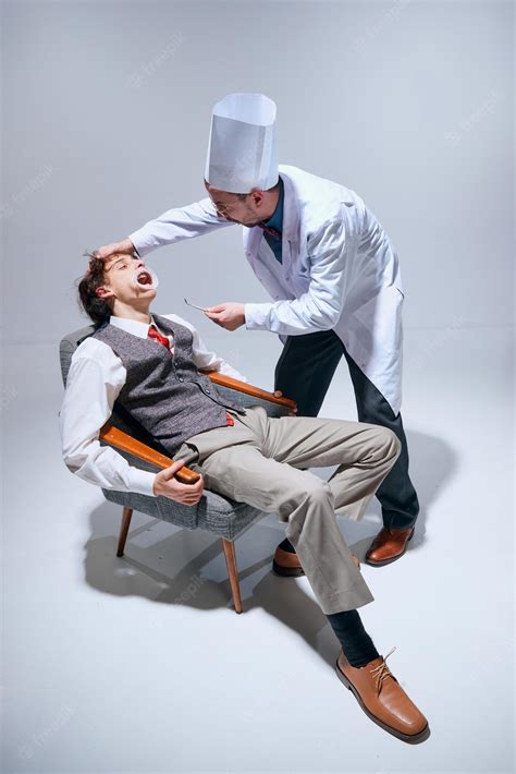 Premium Photo | Young scared man sitting on chair visiting dentist