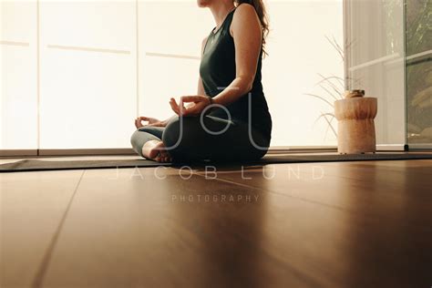 Mature Woman Practicing Sukhasana At Home Jacob Lund Photography